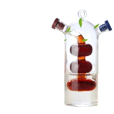 China Sustainable 2 in 1 oil and vinegar separator kettle Glass creative leakproof glass oil flavoring bottle for sale