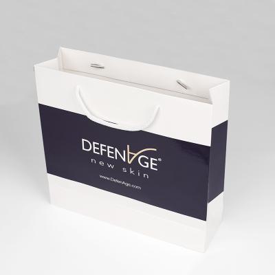 China Recycled Materials Recycled Custom Cardboard Luxury shopping bag Gift Paper Bags With Your Own Logo for sale