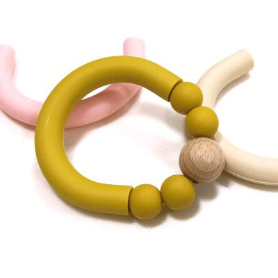 Китай Теплостойкий силикон отбортовывает младенца Teether жуя вышитое бисером кольцо прорезывания зубов 25g продается