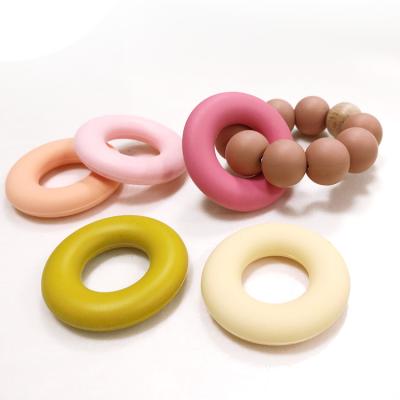 Китай Силикон донута кольца форменный отбортовывает SGS 4.2*4.2*0.9cm Teether для младенца продается