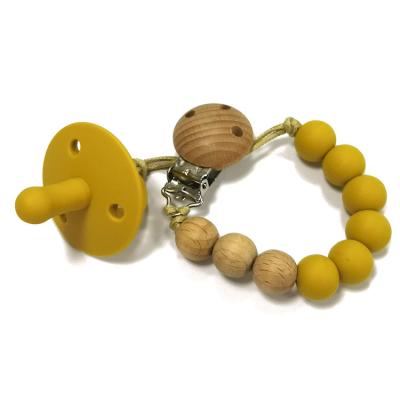 Китай Зажим Pacifier шарика держателя Pacifier силикона жевания прорезывания зубов младенца ODM деревянный продается
