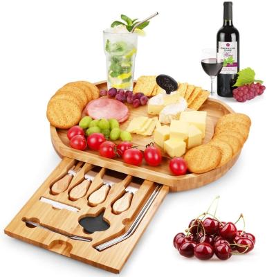 China Sustainable bamboo cheese board wooden cutting board with cutlery in slide-out drawer - Bamboo Charcuterie tray for cookies for sale