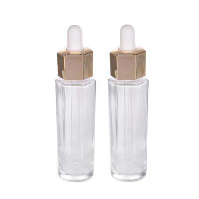 China Personal Care 30ml Hexagon Shaped Glass Dropper Bottle With Gold Dropper Cap Essence Serum Cosmetic Dropper Bottles for sale