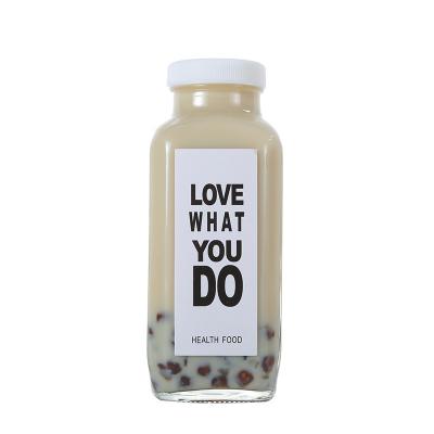 China Wholesale Custom Empty Clear Square Beverage Shape Juice Milk Glass Bottle With Cap for sale