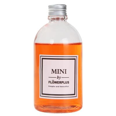 China Wholesale Custom Empty Clear Beverage Round Shape Juice Glass Bottle With Metal Cap for sale