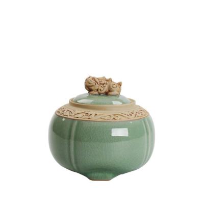 China Custom Green Ceramic Ash Urn Round Funeral Urn From Europe For Human Ashes for sale