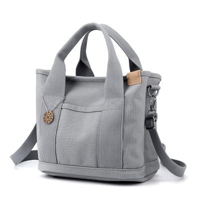 China Canvas PORTABLE Zippered Handbag For Women New Work Lunch Bag Leisure Handheld Small Lunch Bag 2023 for sale