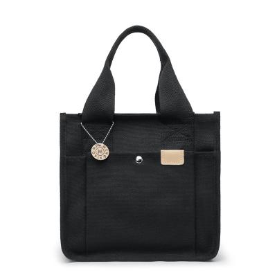 China Fashion Customized Black Logo Printed Fashionable Yellow Casual Waterproof Bag Women's Factory Direct Sales for sale
