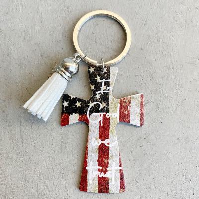 China Retro Cowboy Everyday Life Leather Key Chain Western Cross Tassel Leather Key Ring Handmade Cow Flag Print for sale