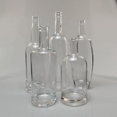 China Special Shaped Clear Round Glass Wine Bottles Wholesale 500ml 700ml 750ml Beverage Whiskey Glass Bottle Liquor Glass Bottle for sale