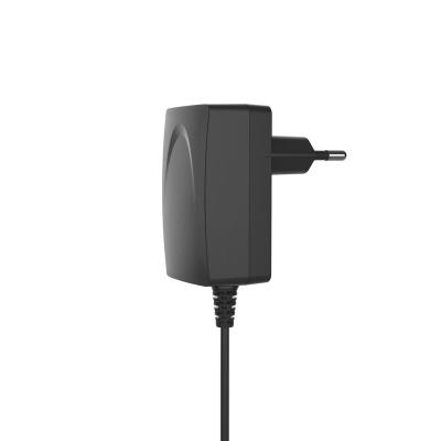 China Universal 12V2A 12W Household Appliance Power Charging Power Adapter Portable Digital Device in Black Color for sale