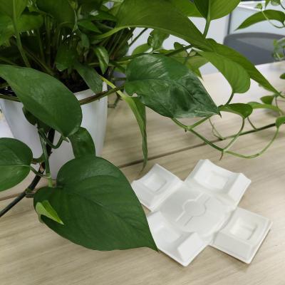 China Environmentally friendly white sugarcane bagasse pulp molding with wet pressing for high-end liquor packaging base, featuring embedded bottle bottom for shock absorption. for sale