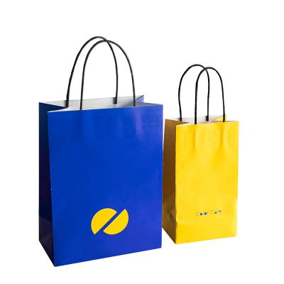China Disposable machine paper bags with your own logo craft paper bag Quality Packaging Kraft Paper Bag with handle for sale