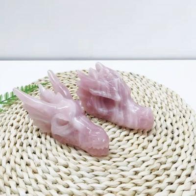 China Europe Customized Natural Crystals Carving Crafts Animal Folk Art Dragon Skulls Rose Quartz Dragon Head for sale