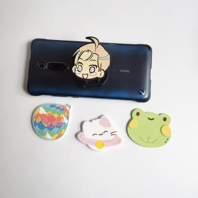 China Adjustable Customized Universal PVC Cartoon Silicone Foldable Mobile Phone Brackets for sale