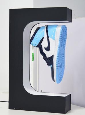 China E shape customize led light magnetic levitation shoes display rack, floating shoes advertising stand for sale