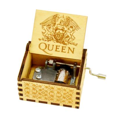 China Lightweight And Portable Wooden Laser QUEEN Engraved Small Hand Crank Music Box for sale