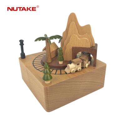 China Music Wholesale Carved Engraving Wind Up Moving Train Pass Through Wooden Tunnel Music Box for sale