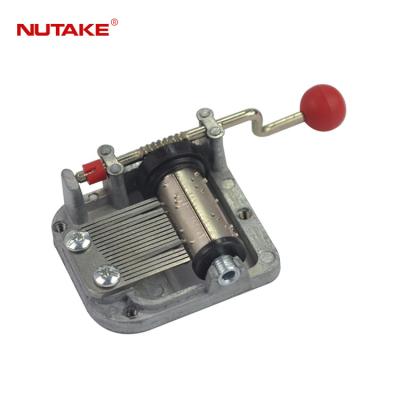 China Part Of Miniature Music Box 18 Note Hand Crank Music Movement With Plastic Ball Handle for sale