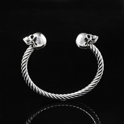China Mighty Opening Double Skull Stainless Steel Twisted Wire Men's Explosive Bracelet for sale