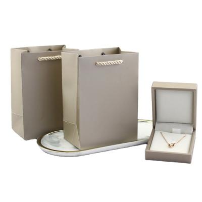 China Recyclable High Quality Custom Logos Paper Bags Gift Bag Designs And Bag for sale