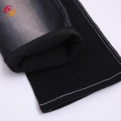 China Breathable suppliers wholesale cheap prices stock lot color knitted jeans cloth material 8oz cotton stretch satin raw denim jean fabrics for sale