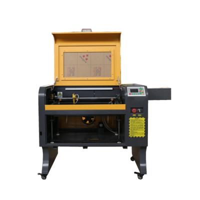 China Laser Engraving M2 or Ruida Controller 4060 USB Port CO2 Laser Cutting Electric Lifting Engraver for sale