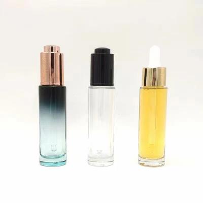 China 30ml Cosmetic Packaging 1 Ounce Empty Yellow Serum Oil Skin Care Cosmetics Cylinder Hair Oil Dropper Glass Bottle With Pump Lid for sale