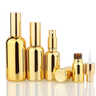 China Gold Cosmetic Perfume Spray Sliding Refillable Glass Pump Bottles Glass Cosmetics Bottle for sale