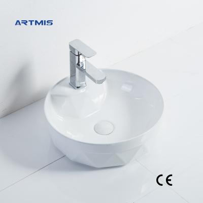 China Modern Hot Selling White Oval Wash Basin Art Ceramic Countertop Bathroom Modern Basin for sale