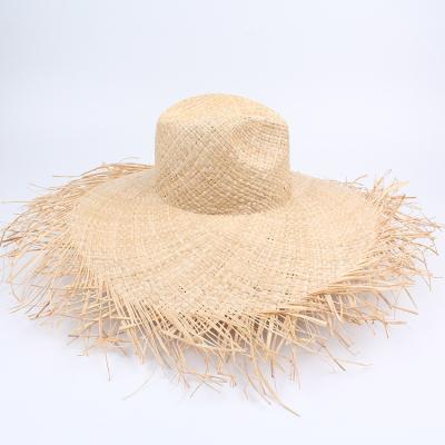 China Beach Stock Women's Raffia Straw Hat Large Wide Rough Overflow Straw Hat Beach Summer Sun Visor Soft Hat for sale