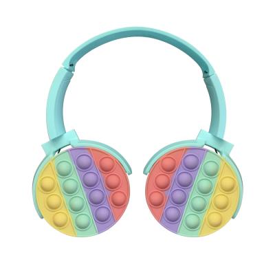 中国 12m Bluetoothの無線ヘッドホーンのシリコーンの破裂音のおもちゃの多彩で美しいヘッドホーンの女の子 販売のため