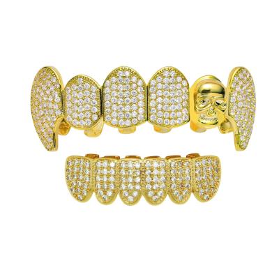 China Nickel Free New Design Lead Free Hip Hops Gold Plated Skull Teeth Grillz Set Micro Pave Zircon Skull Teeth Grillz For Party for sale