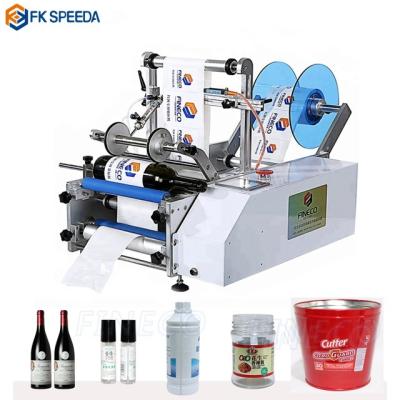 China Automatic Sensor FK603 Semi-automatic Labeling Machine For Cylindrical Round Bottles 20-290mm for sale