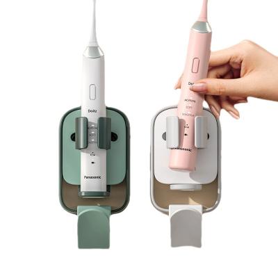 China Multifunctional Wall Mounted Electric Toothbrush Viable Holder Gravity Sensor No Drain Cup Storage Bathroom Drill Organizer for sale