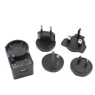 China Universal interchangeable US EU uk AU plugs 5V 1A 2A 2.4A 3a USB Charger for sale