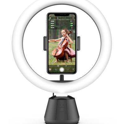 China Smart Cell Phone 360 Track AI Camera Rotating Object Tracking To Cope Tracking Robot Cell Phone Bracket Shooting for sale