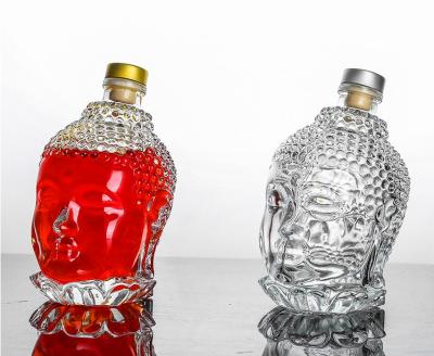 China Whiskey 750ml Fashion Single Head Shape Vodka Whiskey Buddha Glass Whiskey Bottle For Alcohol Drinking for sale