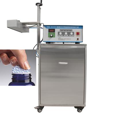 China Automatic Food Factory Vending Aluminum Foil Cap Sealing Machine With Water Cooling System for sale