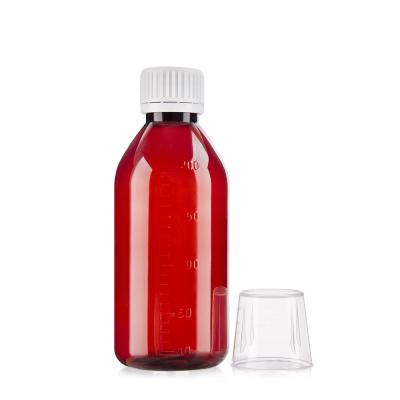 China 4 oz Amber Graduated Oval Liquid Medicine Bottles With Child-Resistant Caps for sale