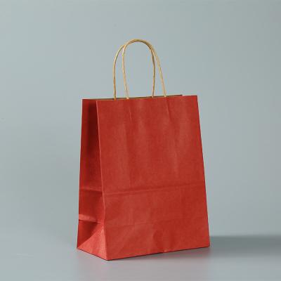 China Recyclable Wholesale Custom Design Portable Kraft Paper Bag Packaging Shopping Bags for sale