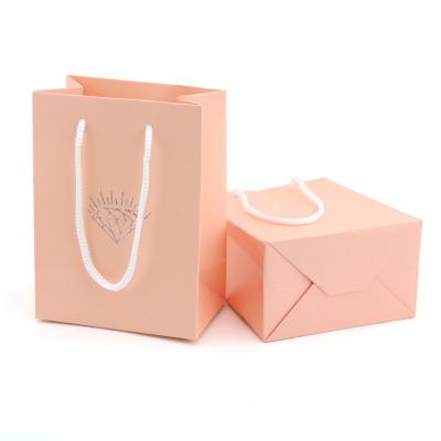 China Recyclable Wholesale Custom Portable Paper Kraft Packaging Shopping Bags for sale