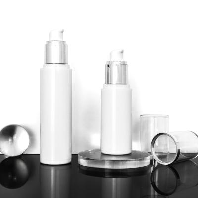 China Personal Care 15m 20ml 30ml 50ml 100ml White Bottle With Silver Airless Lotion Bottle Clear Cover Cosmetic Plastic Airless Bottle for sale