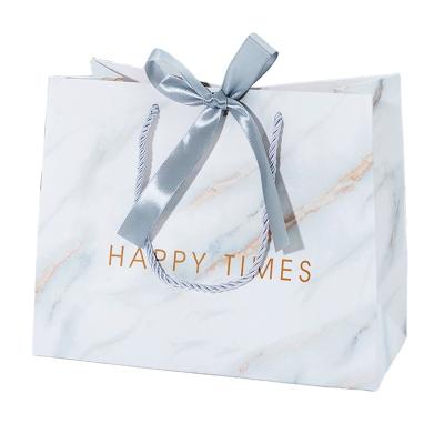 China Creative Marble Printed White Paper Recyclable Wholesale Apparel Gift Shopping Bags for sale