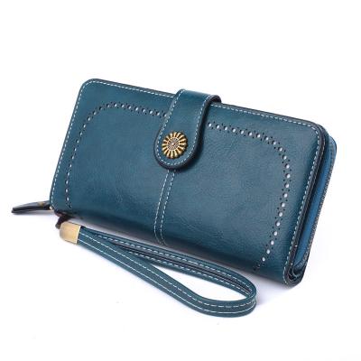 China RFID Women's Wallets, Large Capacity With Rfid Protection, Large Phone Holder Clutch Travel Purse Genuine Leather Wristband for sale