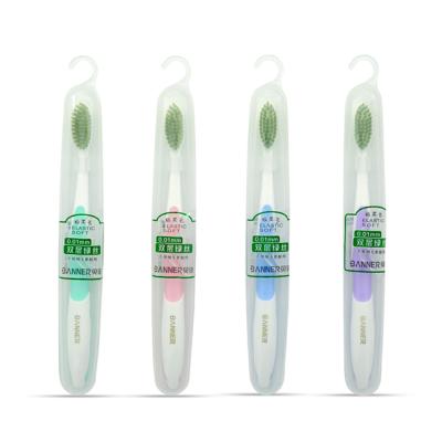 China BANNER Disposable Chinese Dragon Handle With Extra Power Cleaning Green Tea Bristle Toothbrush for sale