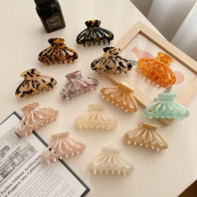 China Hair Claw Clips DIANXIANG 2022 Korean acetic acid caramel milk tea color hollow hair accessories large acetate hair claw clips for sale