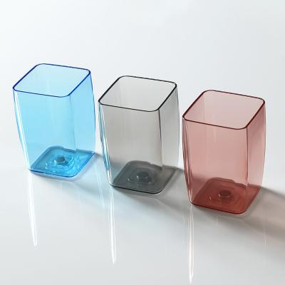 China Wholesale Viable Transparent Colorful Creative Wall Hanging Suction Toothbrush Non-perforated Magnetic Cup Holder for sale