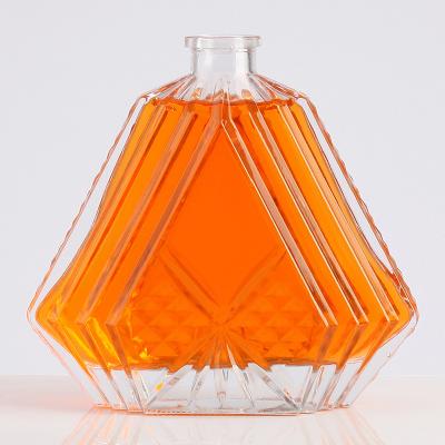 China High Quality Customized Beverage Glass Whiskey Bottle With Embossed Logo for sale