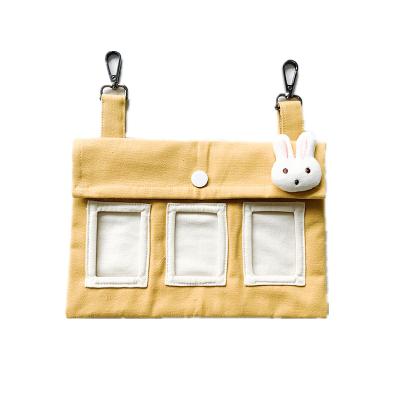 China New Design Multi Colors Automatic Hanging Guinea Pig Cloth Rabbit Hay Feeder Bag for sale